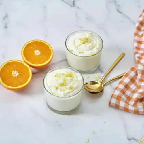 Cottage cheese lemon freezy served in a bowl with fresh lemon slices and mint garnish